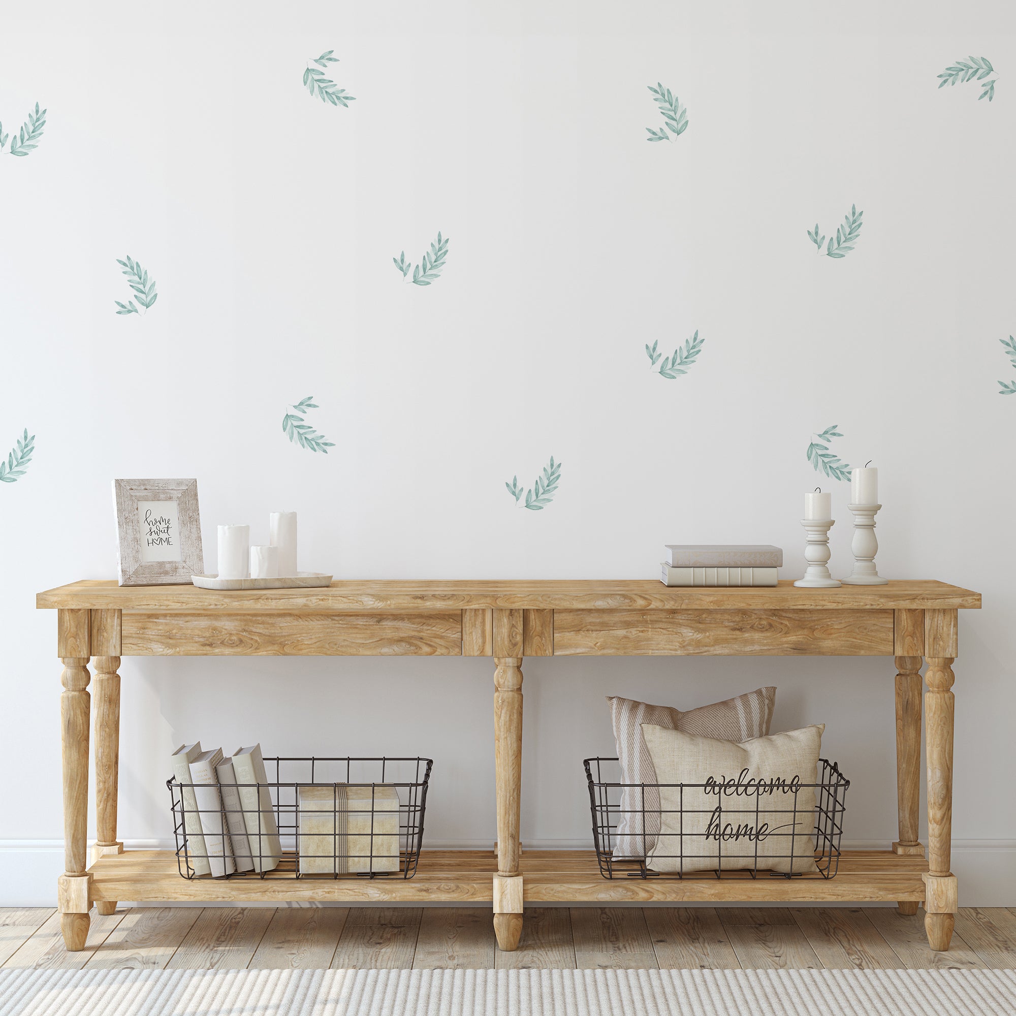 Imagen detallada de vinilo decorativo de paredes en forma de plantas laurel aplicado en pared blanca de recibidor con mueble en madera - Nicolasito.es #color_Plantas-Laurel-Aqua