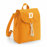 comprar mochilas pesonalizadas con inicial en color mostaza
