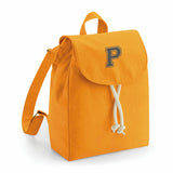 comprar mochilas pesonalizadas con inicial en color mostaza
